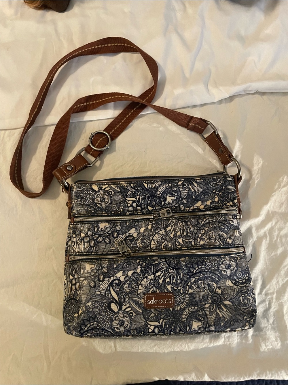 Sakroots Navy Floral Crossbody with Brown Strap Accents